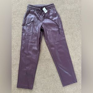 Maroon cropped leather pants with tie waist